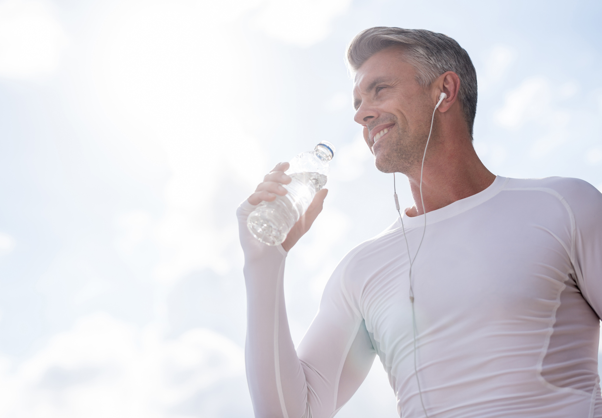 Sports man drinking water